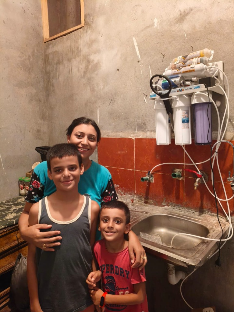 A mother and her children in their kitchen