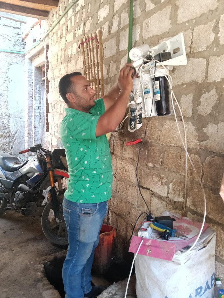 A local worker installing filter system